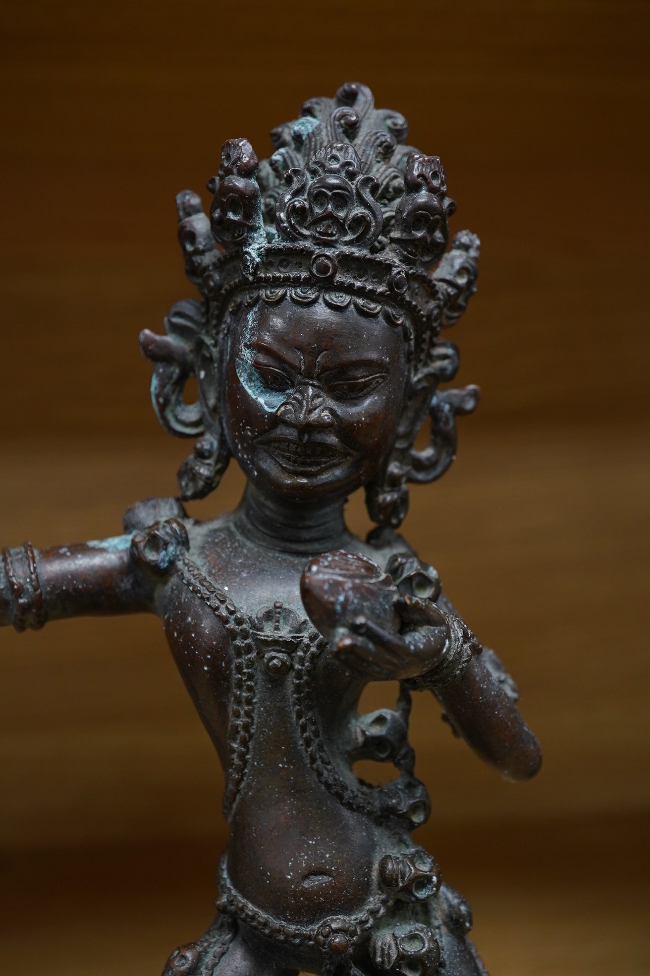 A bronze Tibetan dancing deity, 28.5cm high. Condition - fair to good